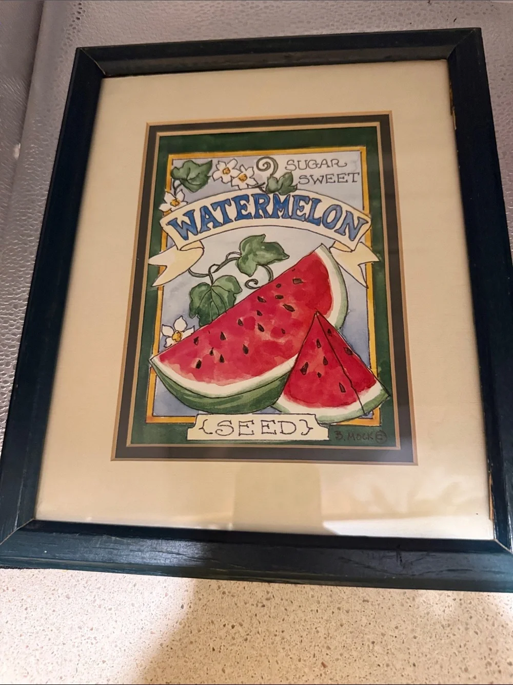 “Large Watermelon Seed Packet” framed picture of a watermelon seed packet.